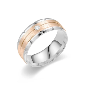Close-up detail of a two-tone titanium steel ring featuring a brushed finish and inset diamond