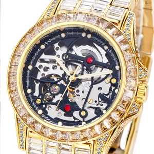 Macro shot of gold skeleton mechanical watch with square-cut gems and detailed movement