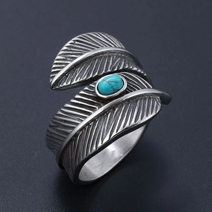 Vintage feather sterling silver ring with oval turquoise stone in retro ethnic style