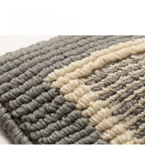 Close-up of durable gray striped polypropylene rug with textured loop pile surface