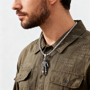 Silver astronaut pendant necklace made of stainless steel with 20mm height on model