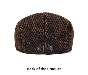 Macro detail of the tie-dye knit newsboy cap rear with decorative metal buttons