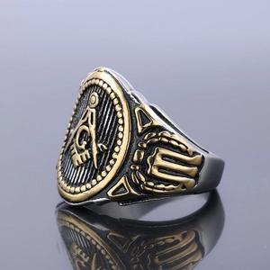 Macro view of Masonic Freemason ring showing gold square and compass engraving detail