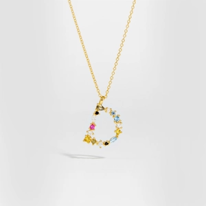 Detailed macro view of S925 silver golden D letter pendant with colorful gemstones