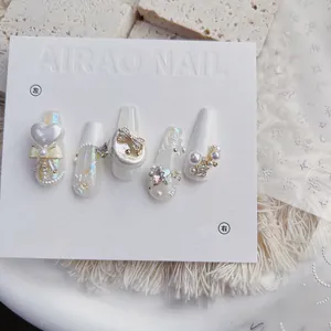 Detailed view of 5D embossed nail art stickers with 3D pearls and star heart designs