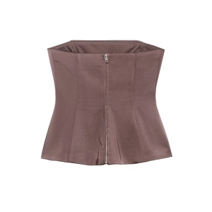 Close-up of brown satin corset top featuring a front metal zipper and structured seams