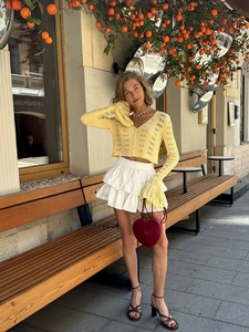Cropped v-neck crochet knit cardigan in yellow with long sleeves and wavy cuffs