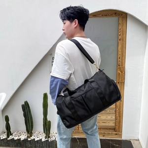 Large capacity black sports travel bag with wet-dry separation and adjustable strap