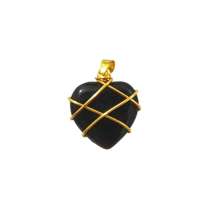 Macro shot of heart-shaped black agate pendant wrapped in elegant gold wire detail