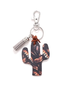 Detail of wooden cactus keychain with orange patterns, grey tassel and silver metal clasp