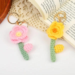 Handmade crochet floral keychains in pink and yellow with gold lobster clasps