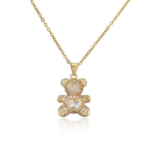Charming gold-tone bear pendant necklace with heart-shaped stone and micro-pave zircons