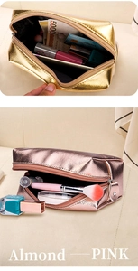 Detail of pink and almond waterproof cosmetic bags with metallic finish and zipper closure