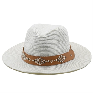 Detailed macro of white woven fedora hat with brown studded leather band and metal rivets