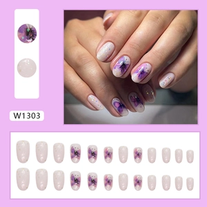 Dreamy purple butterfly press-on nails with glitter accents and a soft gradient finish