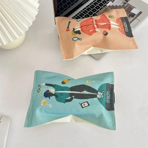 Close-up of stylish cotton linen tissue box covers with vintage character illustrations