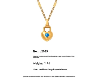 Macro detail of heart-shaped blue turquoise pendant on 18k gold plated steel chain