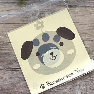 Translucent self-adhesive cookie bags with a cute yellow cartoon dog and thank you card