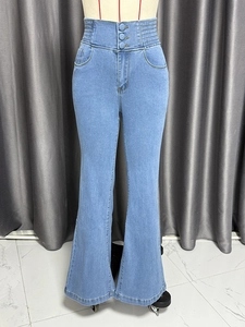 Detail of high waist light blue flare jeans with triple button closure and elastic waist