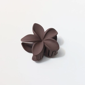 Detailed close-up of 8cm flower hair claw clip with a matte mocha brown finish and firm grip