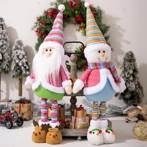 Close-up of telescopic Santa Claus and snowman dolls with colorful knit hats and plush fur