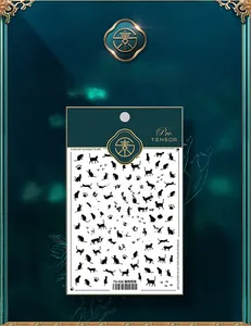 Close-up of TS-426 nail art stickers featuring black cat silhouettes and paw prints
