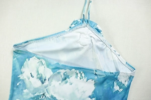 Close-up of blue and white floral print fabric with high-quality stitching details