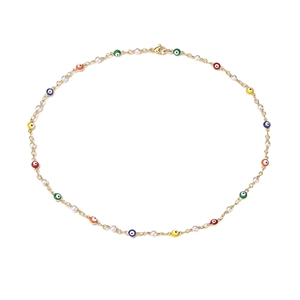 Detail of gold chain necklace with colorful evil eye beads and small white pearls