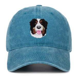 Detailed Bernese Mountain Dog embroidery on a blue denim washed cotton baseball cap