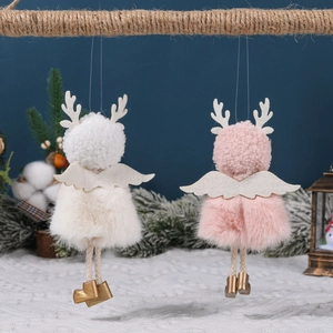 Handmade plush angel dolls in white and pink hanging on rope with festive pine decor