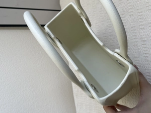 Close-up of minimalist EVA beach bag interior showing material texture and handle rivets
