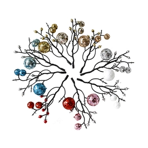 Glittery artificial Christmas berry stems in multiple colors for festive wreath decoration