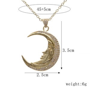 Detailed view of crescent moon face pendant with dimensions 3.5x2.5cm and 45+5cm chain