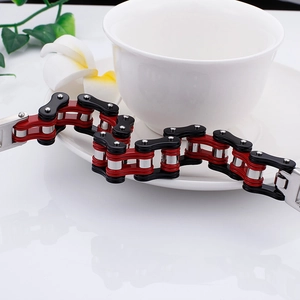 Industrial steel bike chain bracelet for men with red, black, and silver color contrast