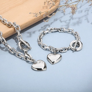 Silver stainless steel heart pendant necklace and bracelet set with OT buckle closure
