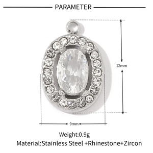 Macro detail of oval stainless steel pendant with zircon centerpiece and size markings