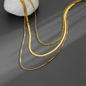 Three-layer gold necklace set featuring sleek snake chain and classic box chain design