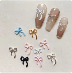 Detailed view of colorful alloy bowknot nail charms for Japanese style DIY manicure design