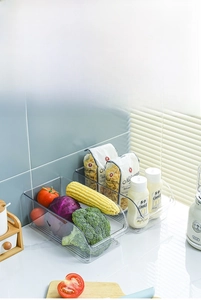 Detailed view of clear food-grade PET kitchen organizer with fresh vegetables and condiments