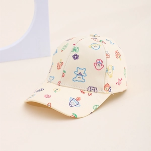 Detailed stitching on children's cream baseball cap with colorful cartoon fruit prints