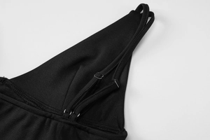 Detail of adjustable metal buckle and stitching on black slim fit camisole straps