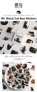 Macro shot of cute black cat stickers for DIY journals showing various kitten poses
