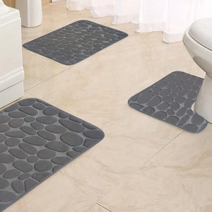 Three-piece grey bathroom mat set featuring a distinctive 3D pebble embossed texture