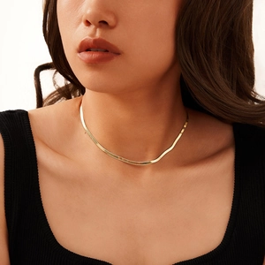 Elegant gold S925 sterling silver snake chain necklace worn on a female neck