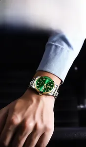 Detail view showing luminous green dial with Roman numerals and dual calendar display