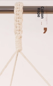 Detailed close-up of handmade cotton rope knots on a woven macrame lampshade