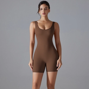 Front view of a brown bodycon yoga romper with deep scoop neck and sleeveless athletic design