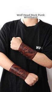 Detail of Viking PU leather bracers with wolf head and Celtic knot embossing