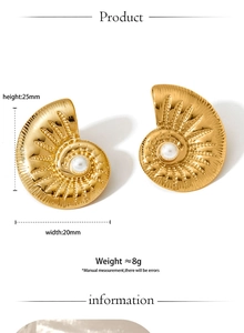 Macro shot of gold nautilus stud earrings with white pearl and brushed texture detail