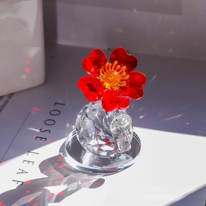 Macro shot of red faceted crystal flower petals on a transparent spherical base